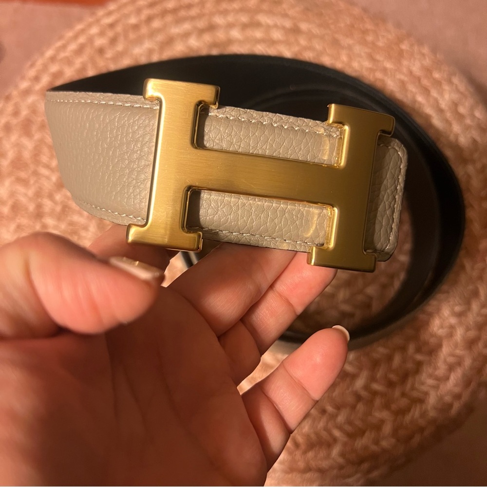 Hermes pewter & black reversible leather belt with a gold color H buckle